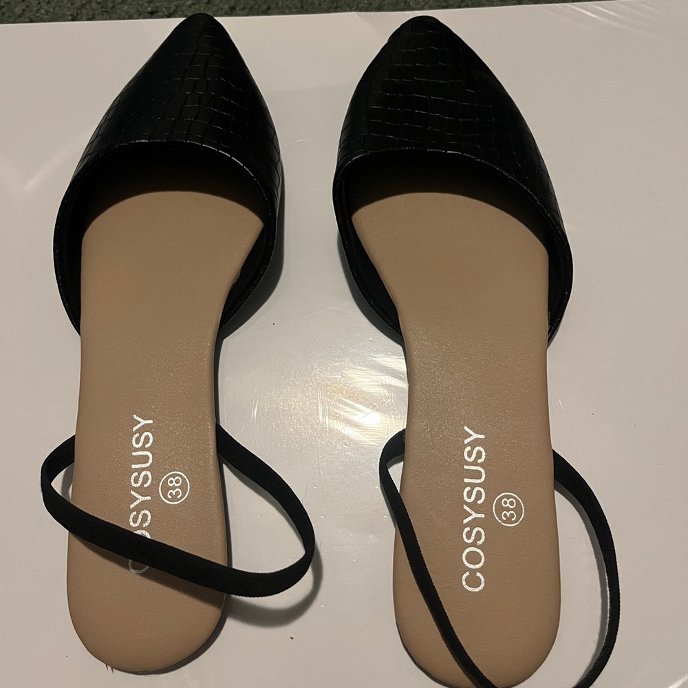 Purchased from SHEIN size 7 brand new without box black flat with strap.